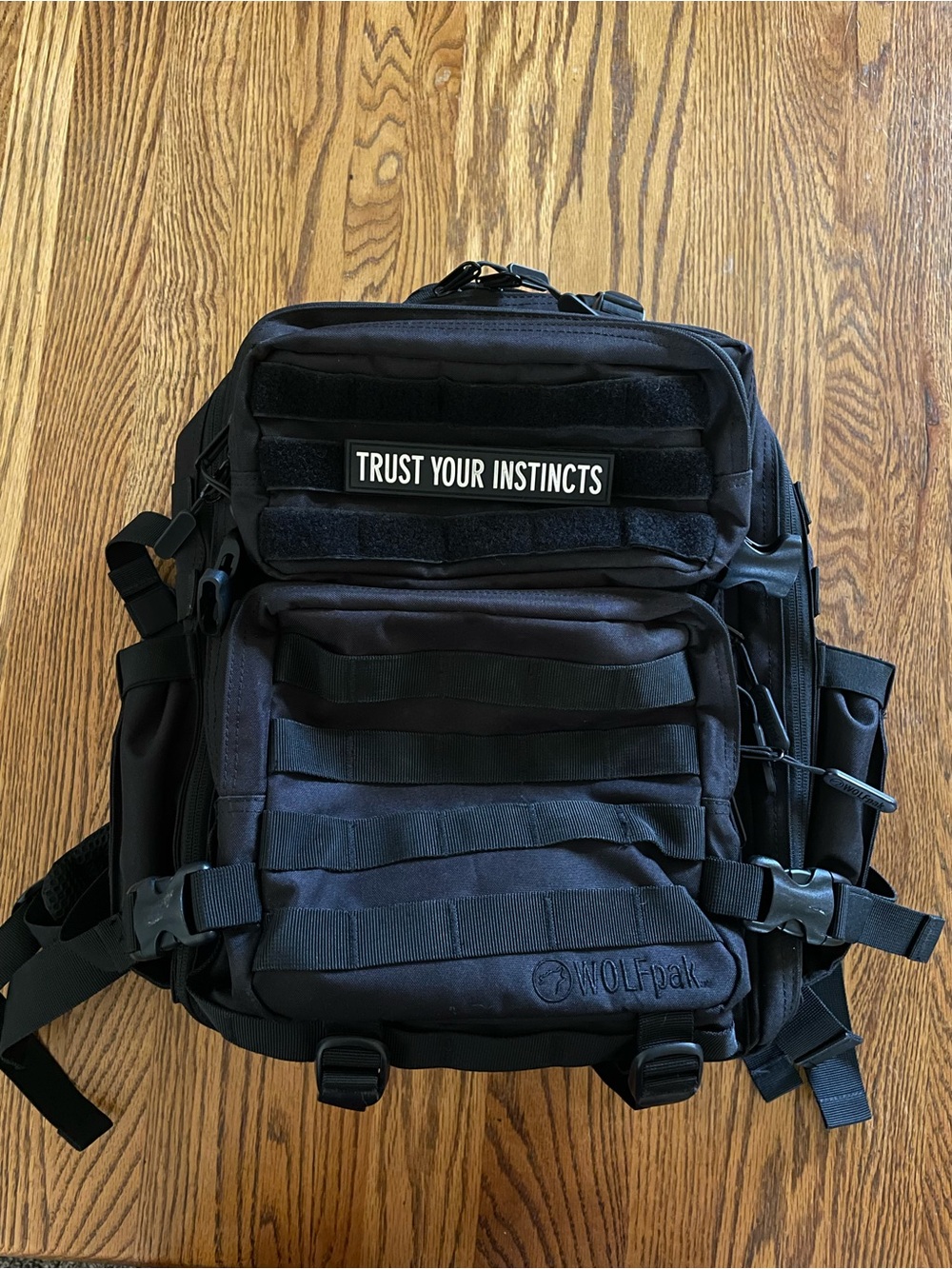 WOLF Black Tactical Modular Backpack with 'Trust Your Instincts' Patch